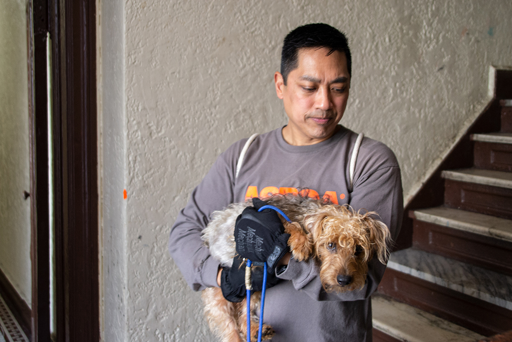 ASPCA responder carrying rescued dog