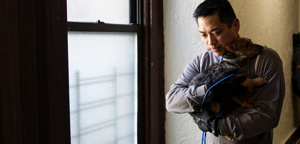 ASPCA responder carrying rescued dog