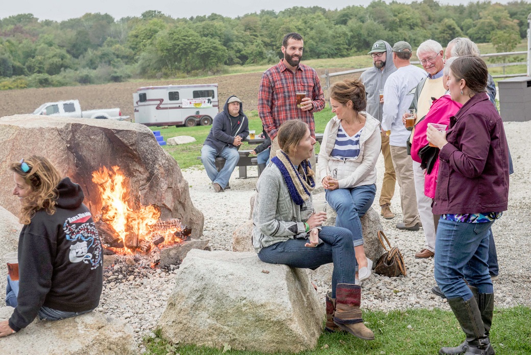 People outside by a fire