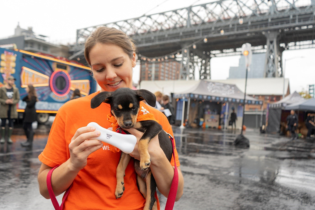 ASPCA employee with a puppy