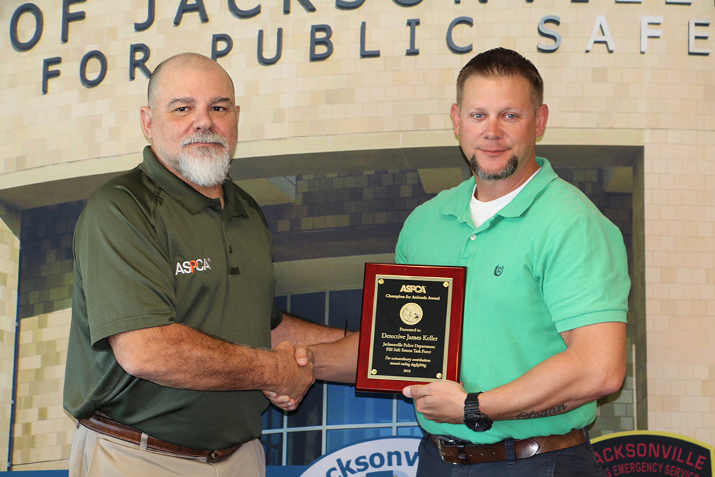 Terry Mills, ASPCA Director of Blood Sports and Detective James Keller of the Jacksonville Police Department.