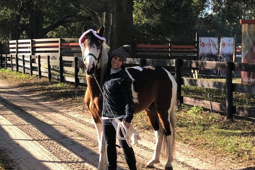 a woman with a rescued horse