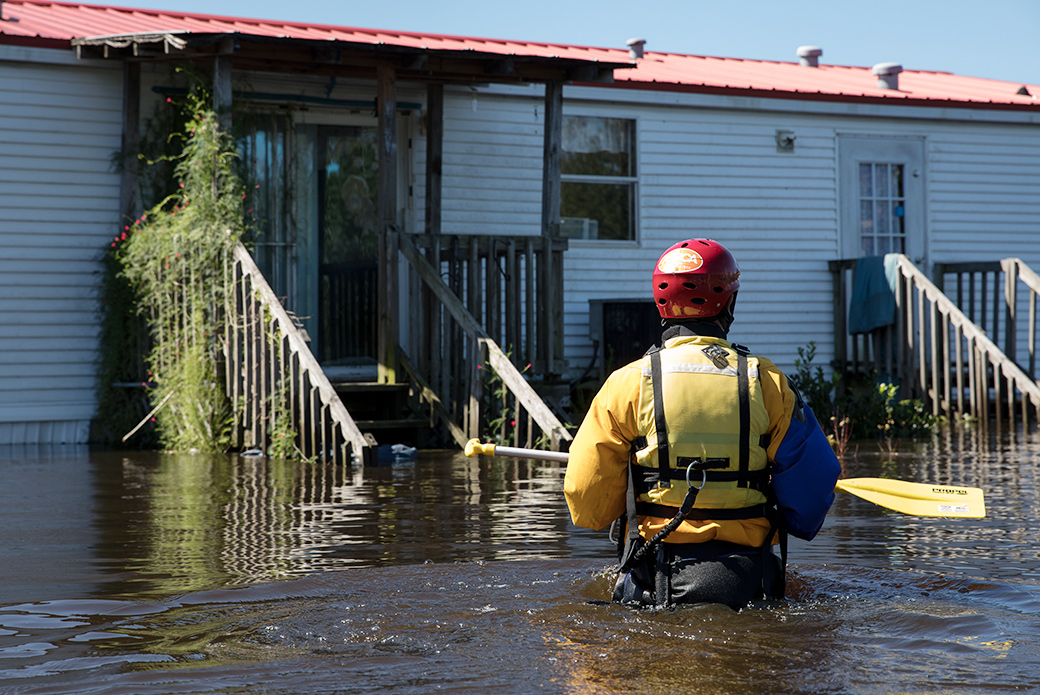 our responder wading through flood water