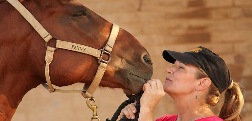 a woman with a horse