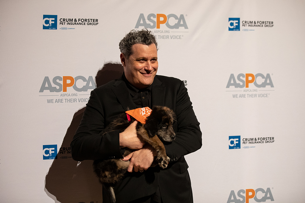 Isaac Mizrahi holding a puppy