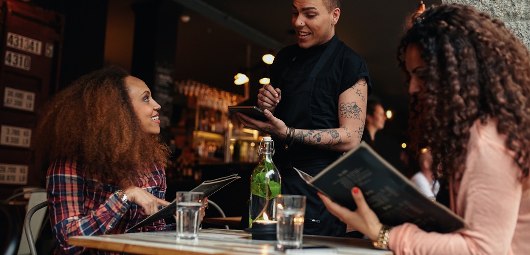 two women ordering at a restaurant