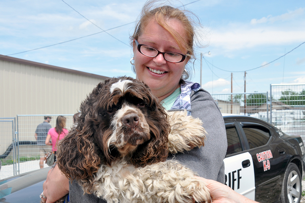 a woman reunited with her dog