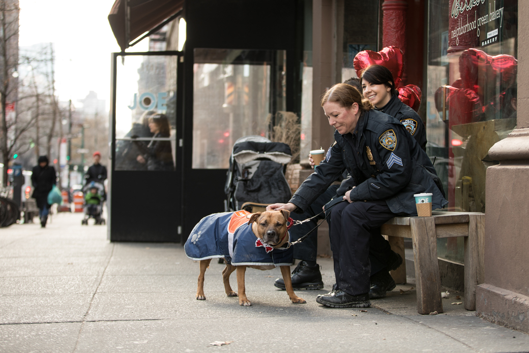 Orson outside a store with Sergeant Maria Sexton and Officer Sara Moran