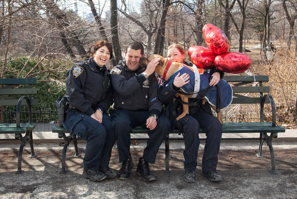 Orson with Sergeant Maria Sexton, Officer Sara Moran and Officer John Riquelme on a bench