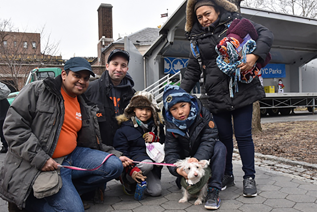 ASPCA staff and volunteer with Maribel and her nephews and their dog