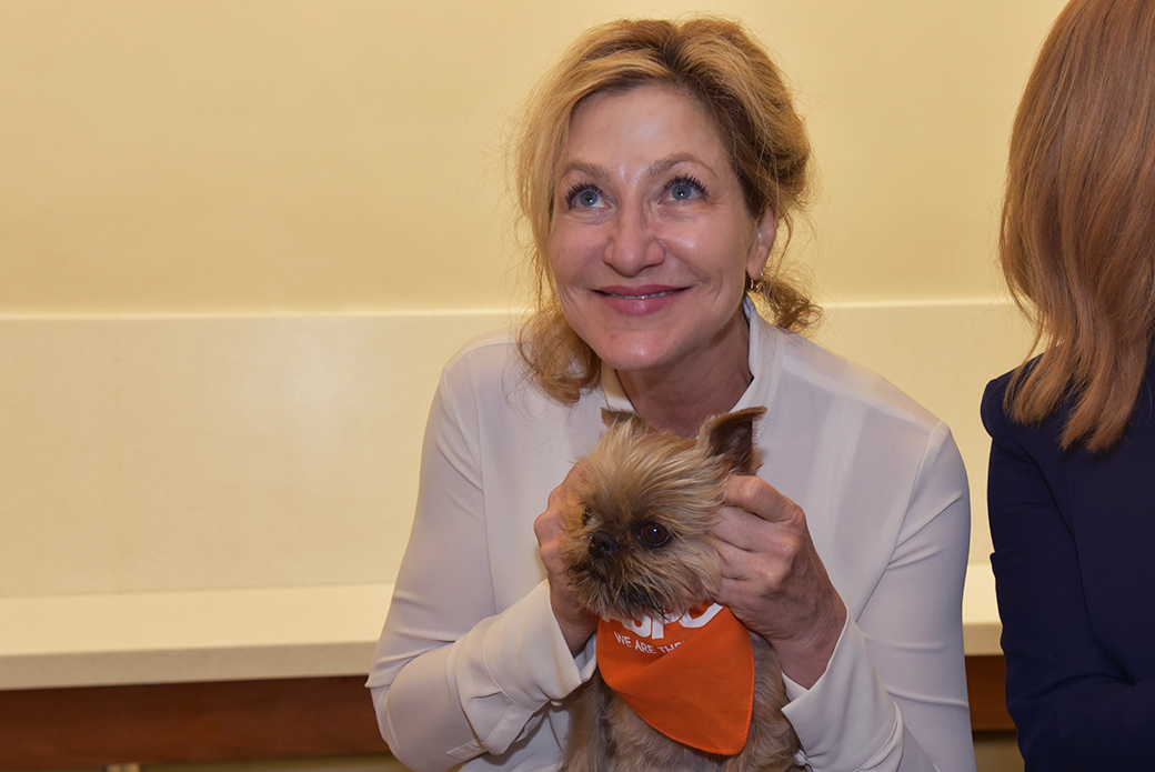 Edie Falco with a small dog