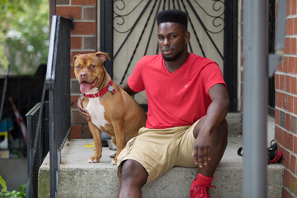 Gemar and Juice sitting on their homes doorstep