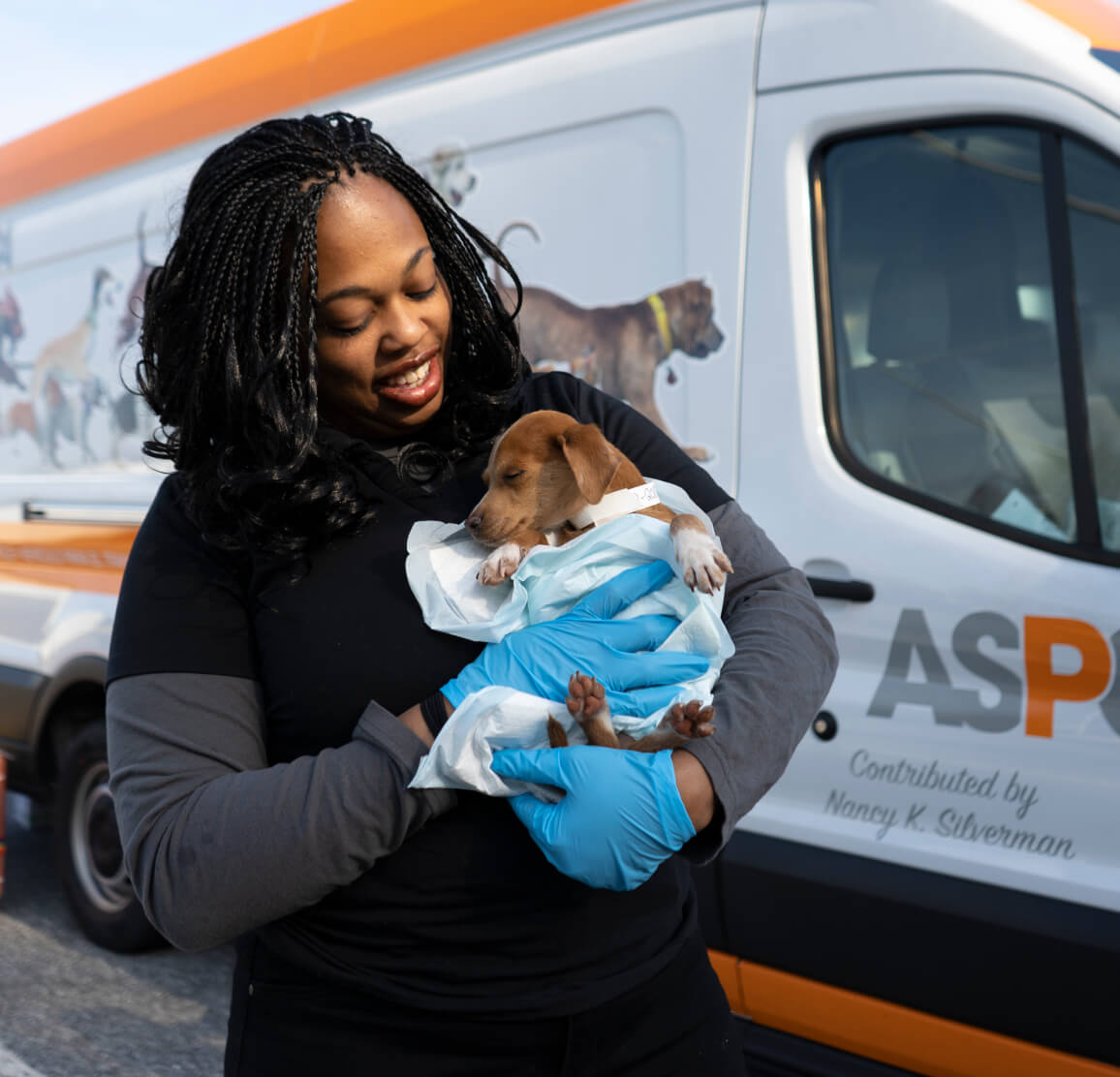 Woman holding dog