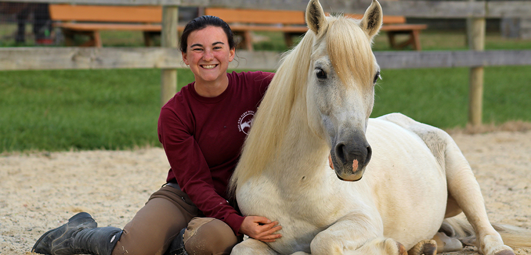 a woman with a horse