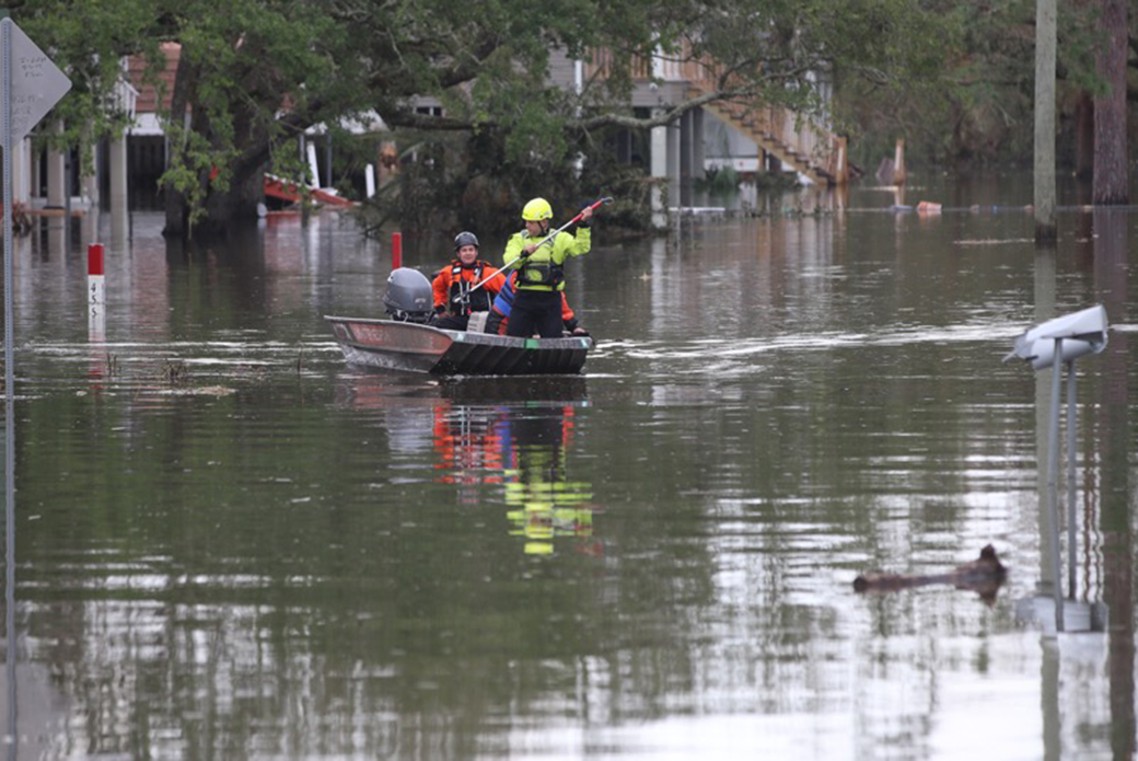 Responders boating through water