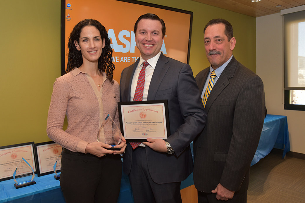 Assistant United States Attorney Michael Longyear with Howard Lawrence and Elizabeth Brandler