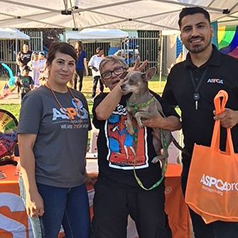 Susan Villa, Miguel Torres with Cindy Birchell and her dog