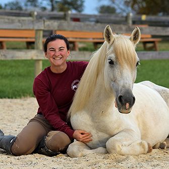 a woman with a horse