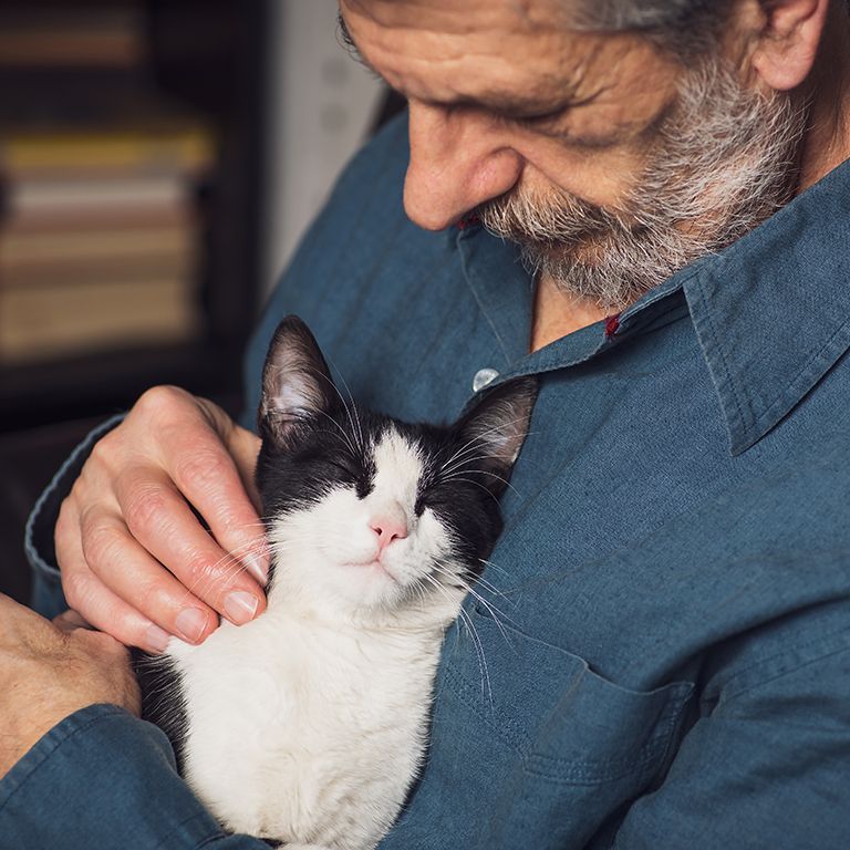 a man with his cat